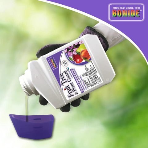 Fruit Tree And Plant Guard Concentrate 16 Oz Foliage Protector For Apple Trees Pear Trees Cherries Tomatoes Roses And More Pro Grade Heavy Duty Shield Against Aphids Japanese Beetles And Other Insects And Diseases being poured from bottle