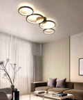 Modern Black Flush Mount LED Ceiling Light 30W 3000K Warm White 89cm Round Four Ring Fixture in a stylish living room setting