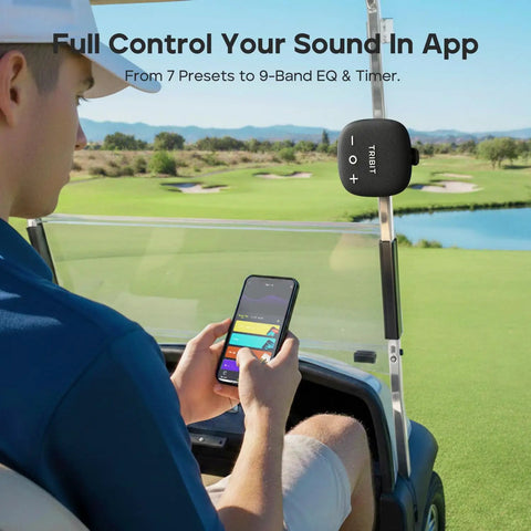 Person using StormBox Micro 3 Portable Bluetooth Speaker With IP68 Waterproofing on golf cart, app control visible