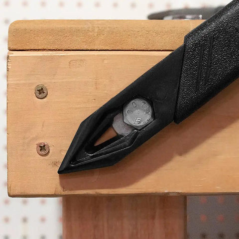 Close-up of 18 Inch Annihilator Utility and Wrecking Bar for Demolition and Concrete Forms on a wooden surface showing a drywall ripper.