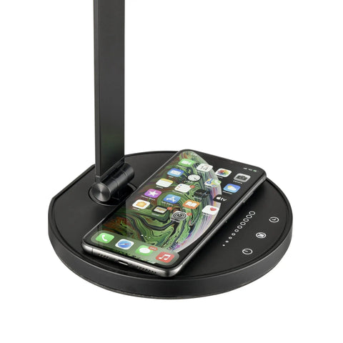 Base of LED Desk Lamp With Wireless Charger And USB Port, phone charging on the base, showcasing touch controls and sleek design
