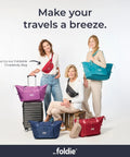 Foldable Travel Tote Bag For Women, 40L Weekender Duffel With Multiple Pockets And Luggage Sleeve in navy blue displayed with models.