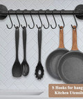 Heavy Duty 3.7 Inch S Hooks For Hanging Jeans Pans Pots Bags Towels And Plants Black Steel Fits Closet Rods Under 1 Inch Diameter Perfect Kitchen And Home Organization Space Saver installed on a kitchen rod with utensils and pans hanging.