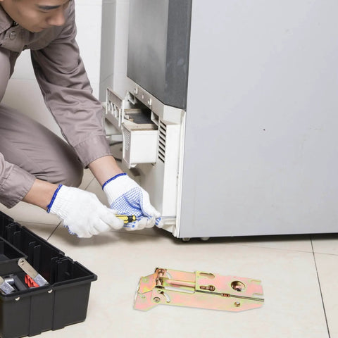 Technician installing Drop Down Chest Freezer Hinge Replacement with durable metal spring, shown with a toolbox next to a refrigerator.