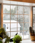 White Plastic Screw Covers For M4 Screws 100 Pack Dome Caps on window frame, providing a clean decorative finish.