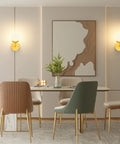 Dining room with Gold Globe Wall Sconce 1 Light Modern Mid Century Dope Gold Wall Light, art piece, and mid-century chairs.