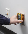 Person using 4 In 1 Breaker Finder, NCV Detector, Socket Tester And LED Flashlight on wall outlet for easy circuit location