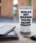 Stainless Steel Insulated Tumbler With Dual Wall Keeps Drinks Hot Or Cold Leak Proof Lid With Clear Slider BPA Free Durable Gift For Men And Women Perfect Anniversary Birthday Or Holiday Present on a table with a phone, wallet, and keys. "World's Best Deburring Tooling Machine Operator" printed on the tumbler.
