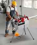 Worker using Three In One Do It All Electric Pipe Threader Machine, 750W Power, 28 RPM, on metal pipe in workshop