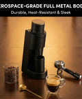 Upgrade Your Morning Routine With This Sick Single Dose Coffee Grinder Featuring A Precision 38mm Stainless Steel Conical Burr And Effortless Stepless Grinding For Perfect Espresso Or Pour Over. A sleek black coffee grinder with a wooden top, coffee beans, espresso shot, and gold spoon.