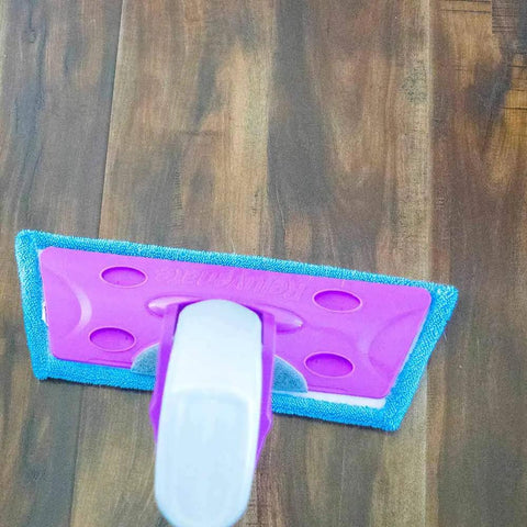 Heavy Duty Washable Microfiber Cleaning Pad Fits Standard Floor Mops on wooden floor, effectively trapping dirt and dust.