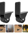 Pair Of Non Swivel Cabinet Casters With L Shaped Plates And Black PVC Rubber Tires for Speakers on a wooden surface.