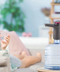 USB Electric Water Bottle Pump With Built In Battery Portable Dispenser for home use, shown on a water bottle, spill-free design.