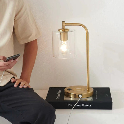 Vintage Brass Nightstand Desk Lamp With Wireless Charging Pad And USB Port LED Bedside Reading Lamp For Bedroom with a person charging a phone