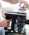 Person replacing SF65 Replacement HEPA Filter For Cordless Stick And Handheld Vacuums, S65 Models, Simplicity Vacuum