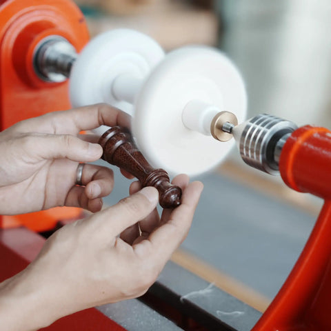 Woodworking Lathe Buffing System Two Step 4 Inch Wheel Buffing Mandrel with MT2 Morse Taper Mounts in use on wood piece