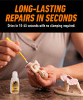 Person using All Purpose Clear Super Glue With Brush And Precision Nozzle Fast Acting Bond For Glass Plastic Wood Metal Ceramic Rubber And Leather 12 Gram Pack For Quick Fixes to repair a ceramic figurine