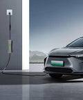 No Sweat NEMA 5 15P To 6 20R EV Charging Adapter 12 Inch UL Listed Cord connecting to an electric vehicle in a garage.