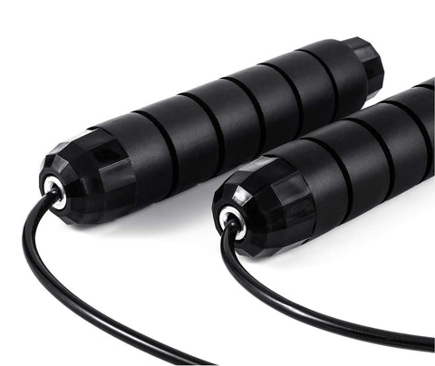 Black handles of adjustable jump rope with ball bearing speed rope for men women kids tangle free skip rope for fast cardio at home gym school.