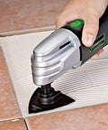 Using Powerfully Versatile Oscillating Tool Kit With 19 Piece Accessory Set 21000 Oscillations Per Minute 4 Pin Attachment on tile grout