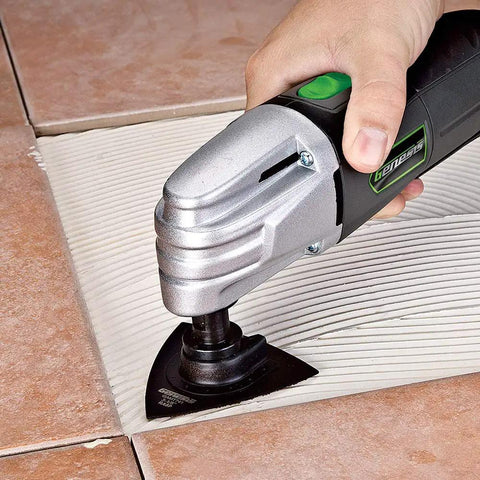 Using Powerfully Versatile Oscillating Tool Kit With 19 Piece Accessory Set 21000 Oscillations Per Minute 4 Pin Attachment on tile grout