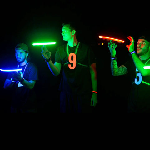 Three people playing with Rgb Led Flying Disc With 108 Multicolor LEDs Auto Light Up And Smart Modes Motion Sensor Waterproof Outdoor Frisbee Toy.
