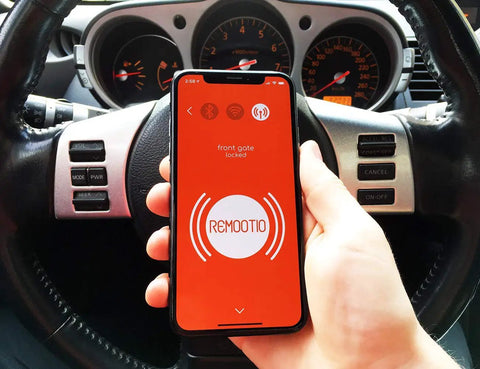 Smart Garage Door Opener With WiFi And Bluetooth, Control From iPhone And Android Apps, Works With HomeKit, Alexa, Google Home, SmartThings, And Siri Shortcuts, Plug And Play Sensor And Power Adapter, 5V DC displayed on smartphone screen in car.