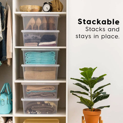 Big Time Seventeen Quart Clear Stackable Storage Bin With Secure Snap Lid For Slick Bedroom Closets Loaded Garages And Wooden Shelving That Gonna Keep Your Setup Tight, stacked on wooden shelf with clothing inside.