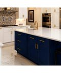 Modern kitchen with 30 Pack Brushed Brass Cabinet Handles 3 Inch Modern Square Drawer Pulls on white and blue cabinets, gold accents
