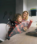 Eye-Caring Clip On Desk Lamp With 360 Degree Gooseneck Reading Light in a home office setting with child and mother at desk
