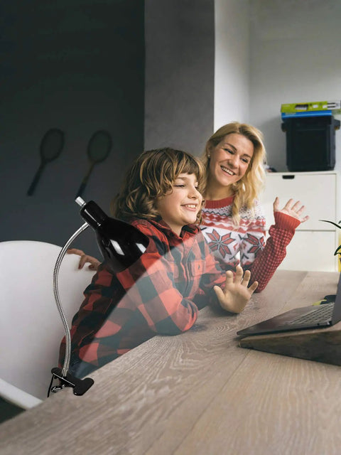 Eye-Caring Clip On Desk Lamp With 360 Degree Gooseneck Reading Light in a home office setting with child and mother at desk