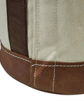 Close-up of heavy duty canvas tool bucket with No 4 canvas and leather bottom, web handle runs down sides for extra strength.