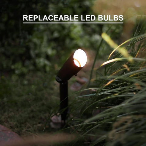 8 Pack Low Voltage Landscape Lighting Kit That Lights Up Your Yard spotlight with replaceable LED bulb, warm white glow.