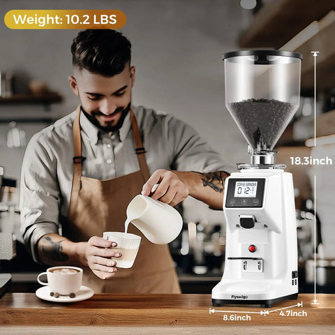 Premium 64Mm Commercial Electric Coffee Grinder With Stainless Steel Flat Burrs And Smart Touchscreen Setup To Easily Crush Beans And Dial In Your Daily Brew Like A Pro In Clean White Finish on cafe counter with coffee preparation.