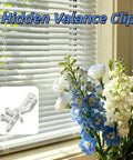 20 Piece Hidden Channel Valance Clips For One Seven Eighth Inch Blinds with transparent design, mounted in living space with flowers.