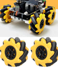 60mm yellow mecanum wheels with black rollers, two pairs, shown installed on a small robot chassis.