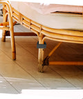Close-up of Rattan Furniture Clips Set 4 Pack For Outdoor Patio And Living Room Easy Install Sofa Alignment Fasteners on rattan leg