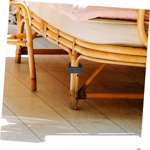 Close-up of Rattan Furniture Clips Set 4 Pack For Outdoor Patio And Living Room Easy Install Sofa Alignment Fasteners on rattan leg