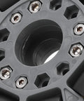 Omni wheel replacement hub, grey plastic mounting plate with hex screws (close-up view)