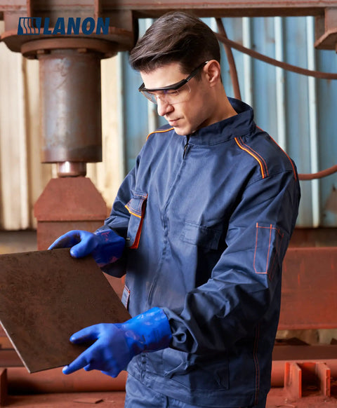 Man wearing Premium Pvc Chemical Gloves With Sturdy Nonslip Grip and Serious Oil Acid Alkali Shield inspecting metal plate.