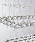 Close-up of raindrop crystals on Lit 8 Light K9 Crystal Modern Flush Mount Ceiling Light Fixture, 31x12x31 inches