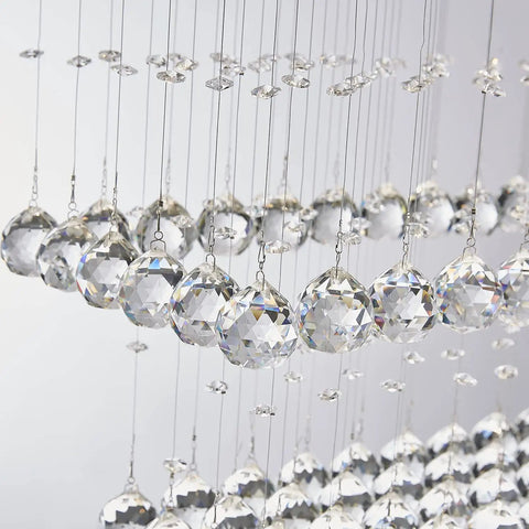 Close-up of raindrop crystals on Lit 8 Light K9 Crystal Modern Flush Mount Ceiling Light Fixture, 31x12x31 inches