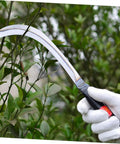 Person using Two Pack Handheld Mowing Sickle For Harvesting And Weeding Comfy Grip Garden And Farm Tool for trimming branches.