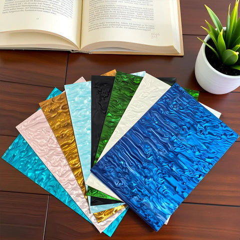 Assorted pearlescent cast acrylic sheets with ocean ripple pattern in various colors, including aqua. Includes PMMA 12x8 inch sheets.