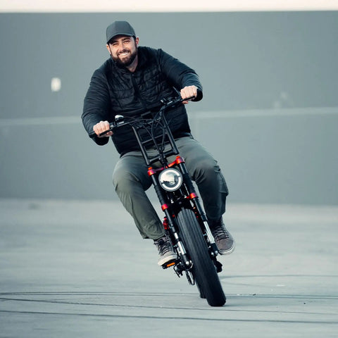 Man riding electric bike with Tough As Nails Heavy Duty 20x4.0/4.5 E-Bike Inner Tubes Set With Butyl Material And Schrader Valve