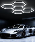 Hexagon Garage Light 168W 5 Grid LED Panel 6500K Cool White Ultra Bright Honeycomb Lighting installed above luxury car in garage