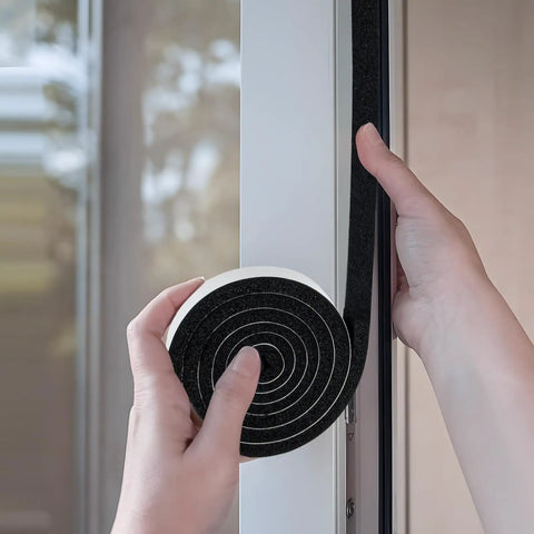 Person applying Rock Solid Open Cell Foam Tape Self Adhesive Sound Insulation Weather Stripping Gap Filler to door frame.