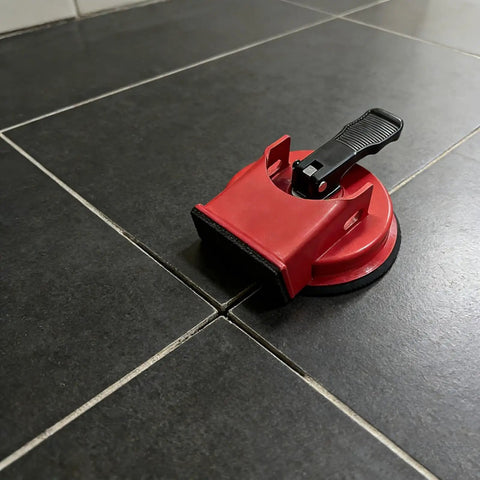 DIY Easy Grip Suction Cup Floor Repair Tool for quick fixes at home without pros, black tile floor, durable ABS and rubber build.