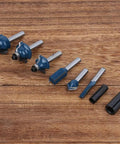 Top Tier Alloy Steel Router Bit Set With 8 Essential Pieces For Smooth Woodworking Milling And Precision Carving Tasks Using 1/4 Inch Shank Design For Pro Shop Results, 8 pieces on wooden surface.