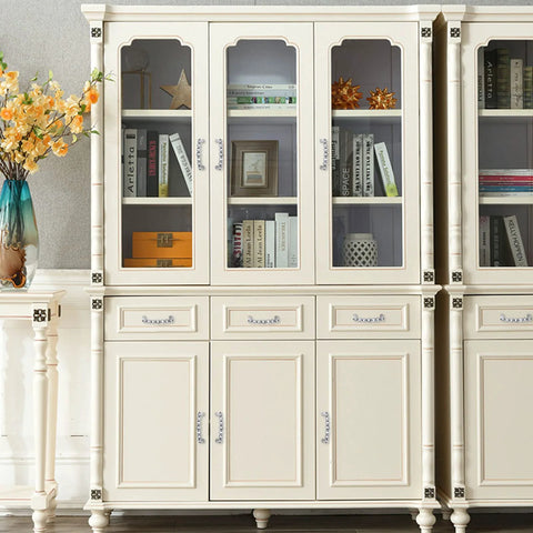 Elegant wooden cabinet featuring ornate crystal glass cabinet pulls with zinc alloy and 7K crystal accents, displayed in a living room setting.